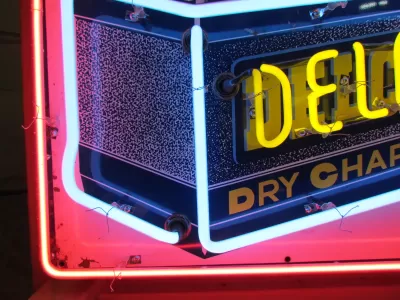 New Delco Batteries "Dry Charge" Porcelain Sign with Neon - 28"W x 20"H 