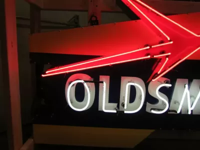 New Oldsmobile Rocket Animated Porcelain Sign with Neon 72 IN W x 38 IN H 