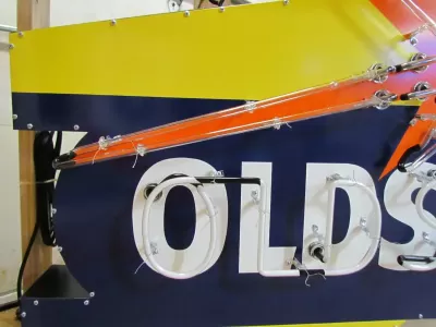 New Oldsmobile Rocket Animated Porcelain Sign with Neon 72 IN W x 38 IN H 