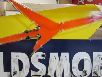 New Oldsmobile Rocket Animated Porcelain Sign with Neon 72 IN W x 38 IN H 