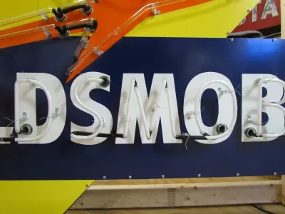 New Oldsmobile Rocket Animated Porcelain Sign with Neon 72 IN W x 38 IN H 